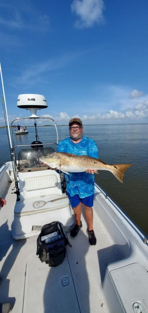 Reel Rusty charter guest with a catch.